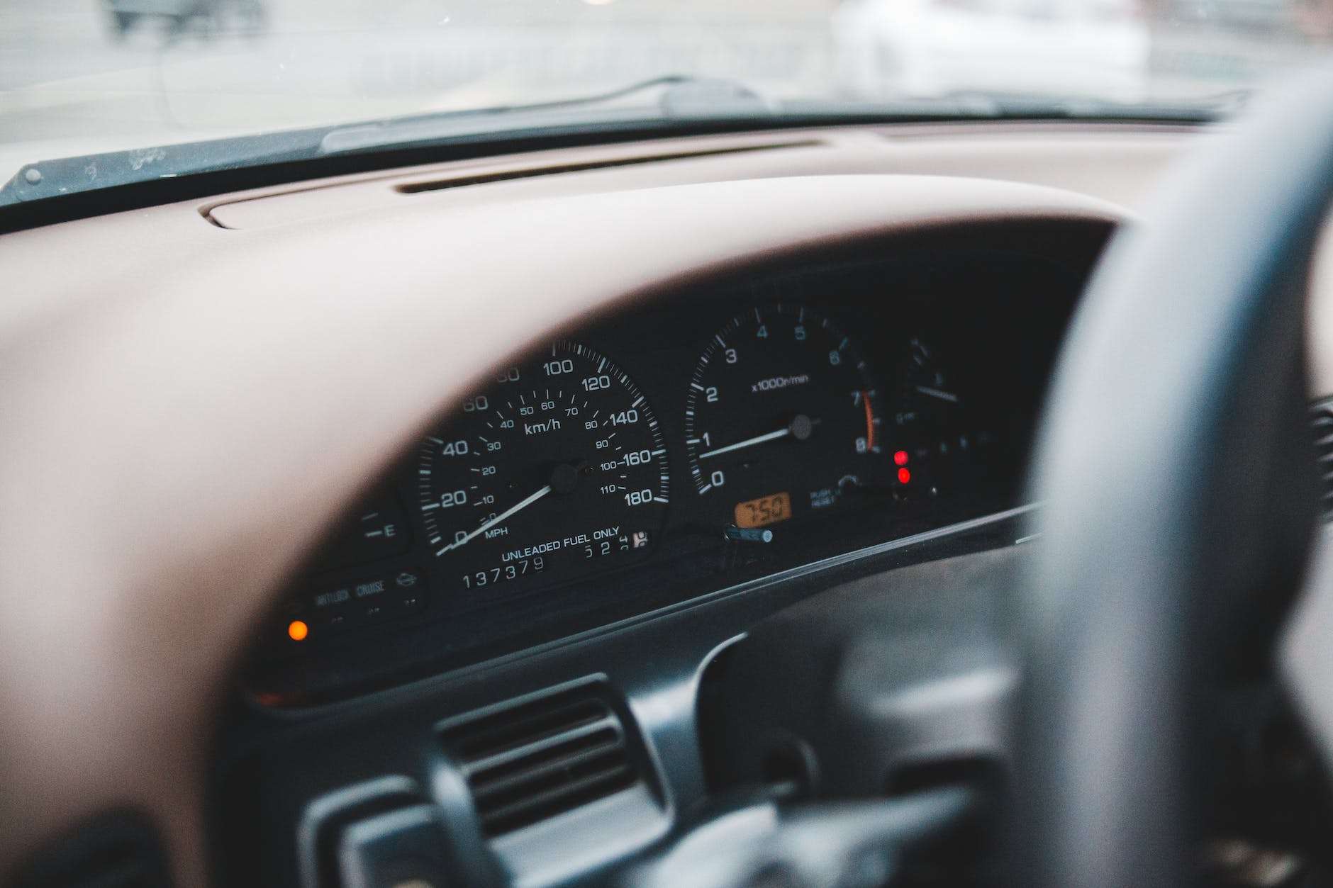 speedometer and part of steering wheel